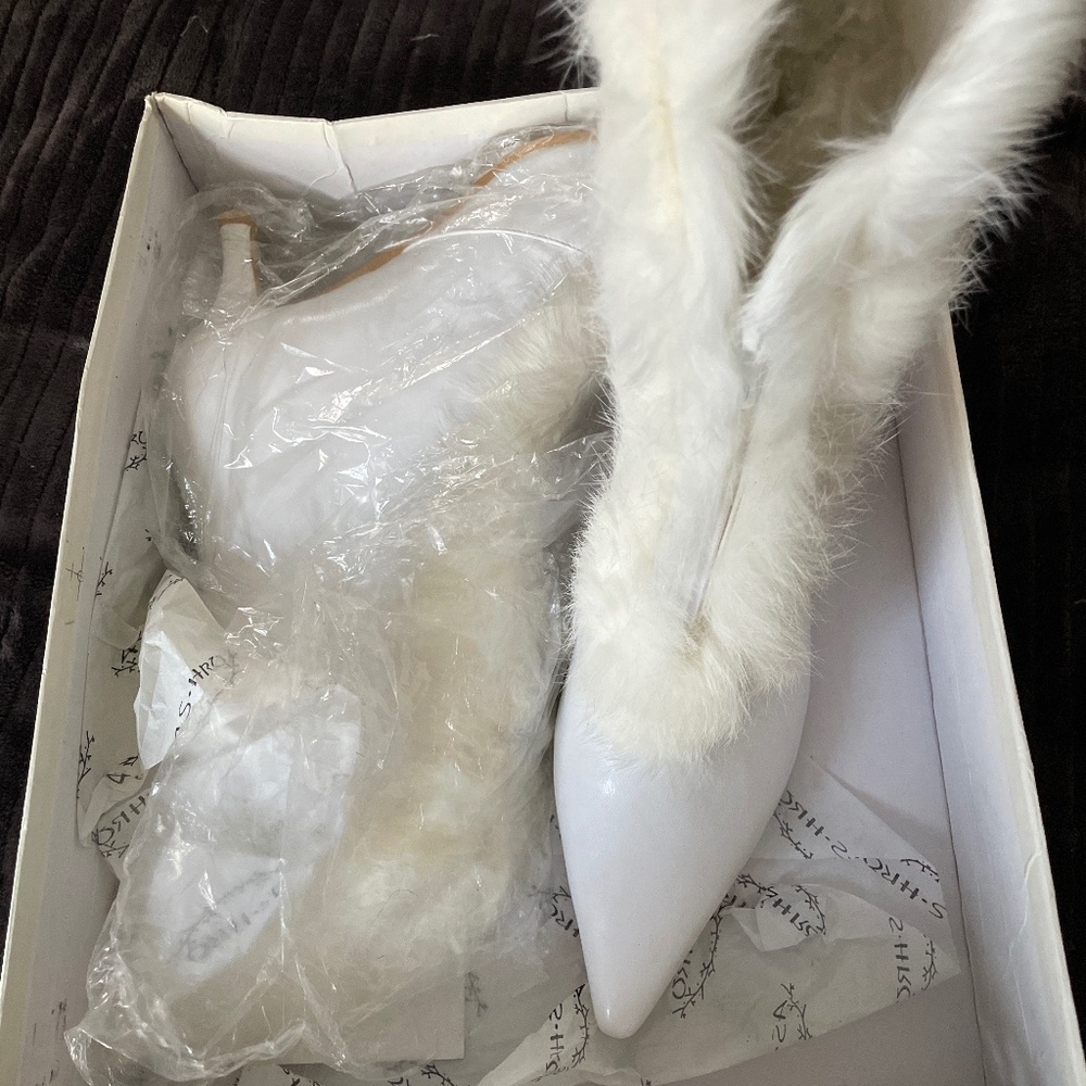 White fur boots.